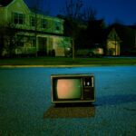 turned off vintage CRT television on road