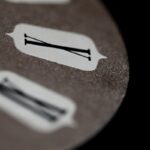 silver fork and bread knife on brown wooden table